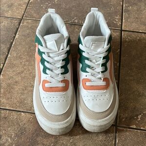 White and Green Sneakers with Orange Accents
